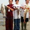 fishing budsL-R- Lexi, Blake, and Zack heft their rollover catch