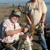 Houston anglers Al Suttle (sitting) and Larry Peacock loading up on flounder- drum- and sheepshead at the Pass-