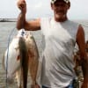 Jerry Wayne of Rollover with stringer of flounder and reds-