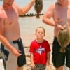 Jason Adam and J.P. Holzley along with young Calab with 2 nice flounder.