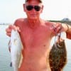 Frank Bunyard of Tarkington Prairrie, TX nabbed this speck and flounder on finger mullet.