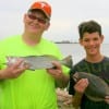 Dad and Son, Roger and Trsitan Wilkins of Baytown, TX took this trout and flounder on electric chicken mirror lures.