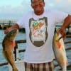 Sam Page of Houston hefts his nice reds caught on finger mullet