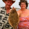 Pat and Helen Vanya of Hardin takes home a flounder caught on finger mullet.