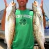 Troutmaster Ed Bain of Splendora, TX nabbed these two 6lb trout in the surf on Mirror Lures.