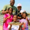 The Spiller family of Houston heft Bishop and a trout caught on shrimp.