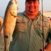 TJ Jackson of Baytown, TX landed this nice red fishing finger mullet.