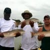 Darius Jones, Vincent Butler and Scott Harp of Houston heft these nice reds caught on finger mullwt.