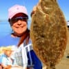 Laurie Long of Rochester, TX put this keeper flounder in the box fishing finger mullet.