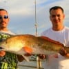 Jesus Mendoza and Jasil Soriano of Pasadena, TX heft their 41 inch tagger bull red caught on sting ray.