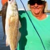 Poochie Walker of League City, TX caught this keeper red on finger mullet.