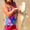 Kimmie Wheeland of Lufkin, TX hefts a nice red.