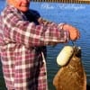 Betty Elliott of Houston showing off her 21 inch flounder she caught on live mullet.