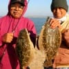 Brothers Thomas and Nelson Varghese of Houston took these 19 and 20 inch flounder on finger mullet.