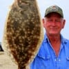 Frank Bunyard of  Tarkington Prarrie TX nabbed this nice flounder on soft plastic.