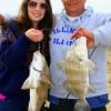 Father and Daughter, Samantha and Victor Garcia of Houston heft their drum just caught on  shrimp.