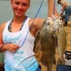 Jalyn Morrison of  Hemphill, TX hefts her drum and sand trout she caught on shrimp.