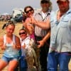 The Morrison  family of Hemphill, TX display their catch of trout, drum-and whiting they  caught on shrimp.