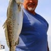 Former Marine Margarito Rosales of ChannelView, TX hefts this 4lb speck caught on plastic.