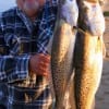 Jean Scurtu of Houston fished crappie jigs for these two impressive trout.