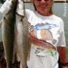 Alice Dykes of Lufkin TX hefts these 3.5 and 5lb trout caught on soft plastics.