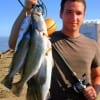 Ryan Benedict of La Porte, TX shows off the trout he night fished with mirror lures to catch.