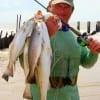 Ricky Tribble of Winnie TX wade-fished the surf with a C-8 Mirror lure to string up this nice mess of trout