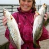 A very wet Alice Dykes of Lufkin TX fished Berkley Gulp for these two keeper Specks