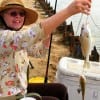 Crosby TX anglerette Joye Brown was catching croaker 2 at a time here at the pass for her family fish fry