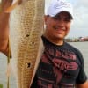 Dominick Sanchez of Dallas hooked this 34 inch tagger bull red on cut bait