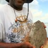 George Love of Houston cradling his flounder dinner he caught on live shrimp