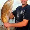 J.D. Heaton of Conroe TX shows off his 37 inch tagger bull red he caught on shrimp