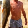 John Burnett of Winnie TX fished cut mullet on the Gulf side for this HUGE 44 inch tagger bull red