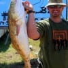 Kayak angler Kevin Matthewson fished the surf a with live finger mullet to catch this HUGE 39 inch tagger bull red-