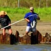 Mama Culver netting her son Greg Culver's very first redfish at Rollover Pass