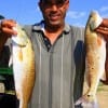 Melvin Riles of Houston nabbed these two slot reds on finger mullet