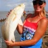 Nancy Talley ofPort Bolivar TX landed this nice 28 inch slot red on a finger mullet