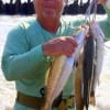 Ricky Tribble of Winnie TX waded the early surf with a Catch 2000 to string up these nice specks