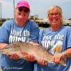 The Thompson Twins heft this nice red that was caught on a live finger mullet