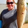 Whitney Holt of Porter TX nabed this 28 inch slot red on a finger mullet