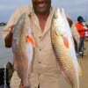 Charles Brown of Missouri City TX nabbed these two nice slot reds on finger mullet