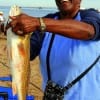 Mattex Bammer of Houston was a happy angler when she caught this 25 inch slot red on shrimp