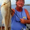 Nothing to it! Mark Spears of Galveston seems to say after catching this 25 inch slot red on shrimp
