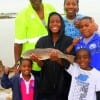 Rollover Pass Hero Glenn Bailey and Family showing off their nice slot red they caught for supper - This is the man who saved a drowning man at Rollover Pass