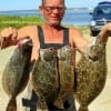 Stacey Crews of Crystal Beach TX wade-fished Rollover Bay with Berkley Gulp to catch this impressive stringer of flounder -plus- a 22 incher