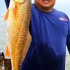 Tomball TX angler Dan Luangpakdy took this colorfull slot red while fishing a popping cork shrimp