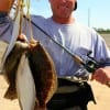 Wade-angler Rich Andrews of Sugar Land TX waded Rollover Bay with Berkley new penny jerk n'shads for this impressive 5 flounder limit