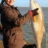 An excited Kathleen Morua of West Houston managed to catch her BIGGEST fish ever, a 39 inch Bull Red while fishing a mud minnow