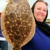 Kimberly Beyer of Beaumont TX took this nice18 inch flounder while fishing a mud minnow