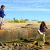 Madre and Daughter beach landing a 39 inch Bull Red